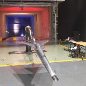 Aircraft model in wind tunnel testing.