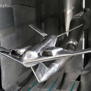 Polished stealth aircraft scale model in wind tunnel