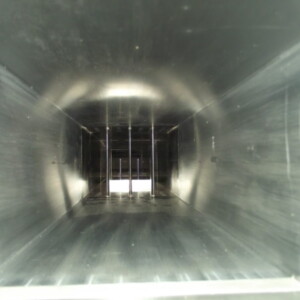 Interior of a long, metallic duct.