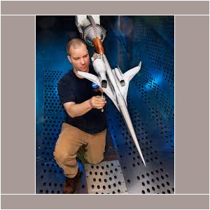Engineer inspecting hypersonic aircraft model.